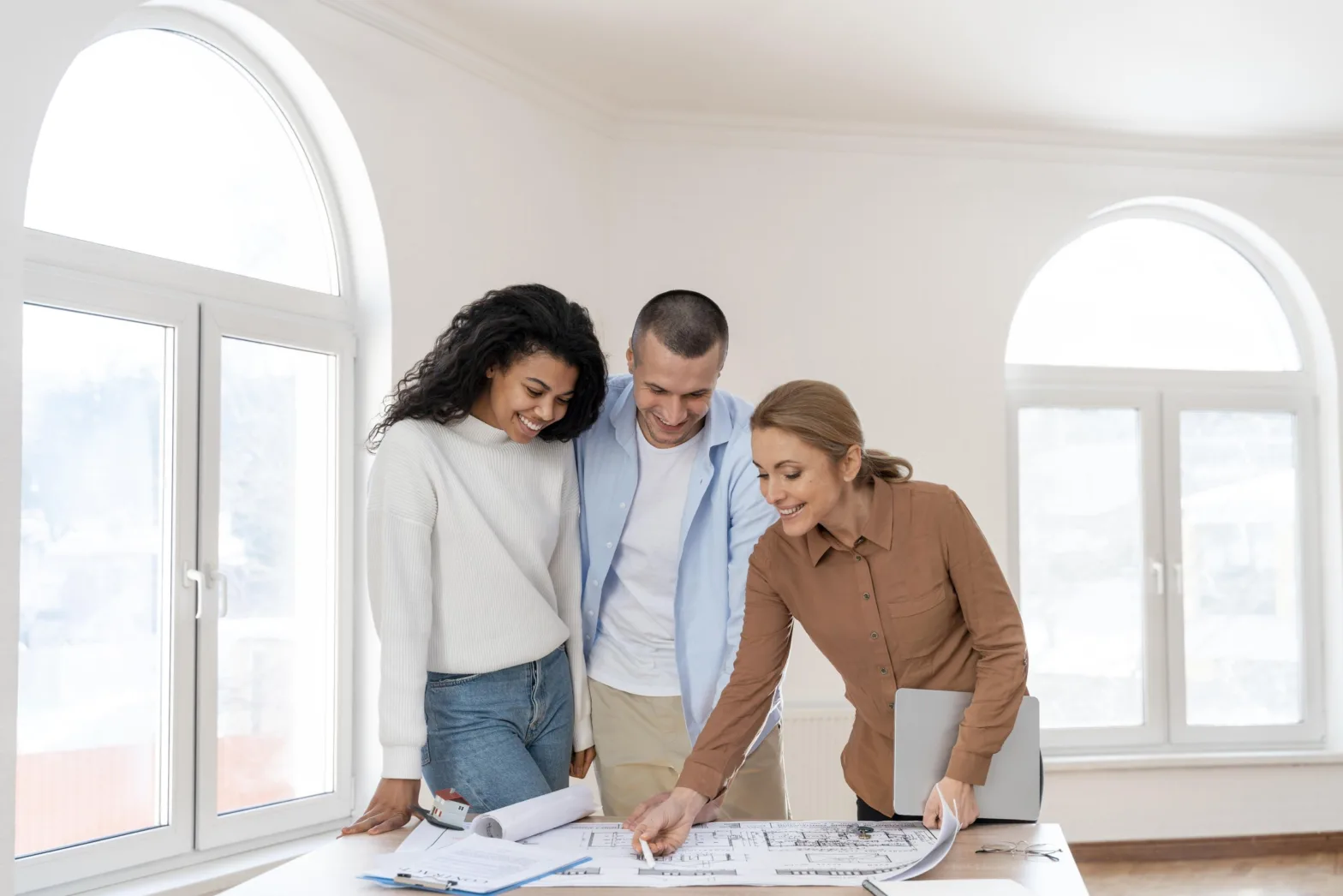 front view female realtor showing new house plan couple