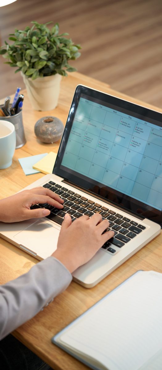 Business woman making schedule for the month